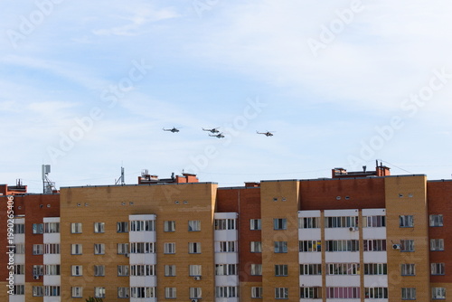 Helicopters fly in the sky above the city 