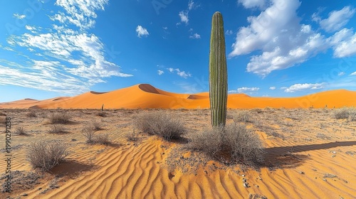 Ancient Stone Monolith in a Sandy Desert Landscape Under a Bright Blue Sky with Scattered Clouds