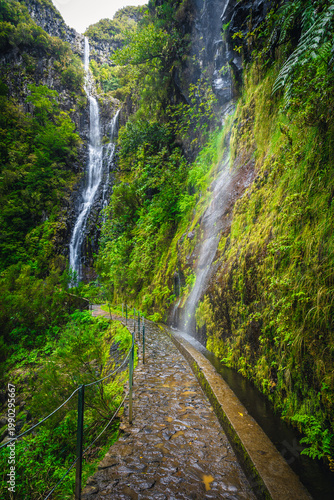 Spectacular levada hiking trail and high waterfalls, Madeira Island, Portugal