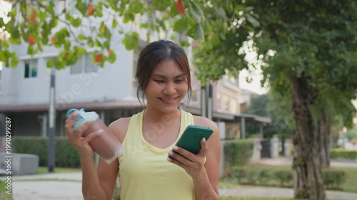 Young active woman drink whey protein shake bottle eating diet food using phone calorie AI plan app after workout health care asia people happy relax anti aging life weight loss walk public green park