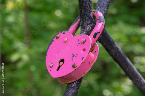 Photography A pink lock on a fence: a symbol of love and fidelity