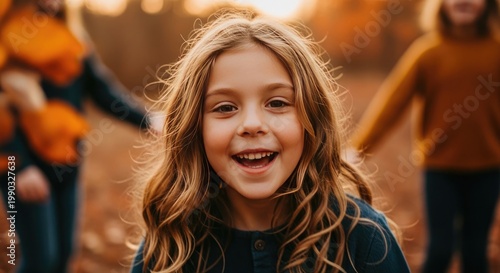 Smiling young girl in autumn a portrait of joyful childhood