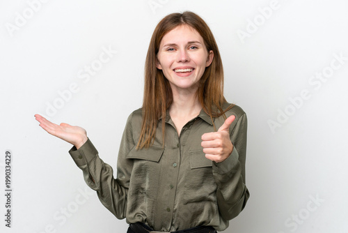 Cuadro en lienzo Young English woman isolated on white background holding copyspace imaginary on