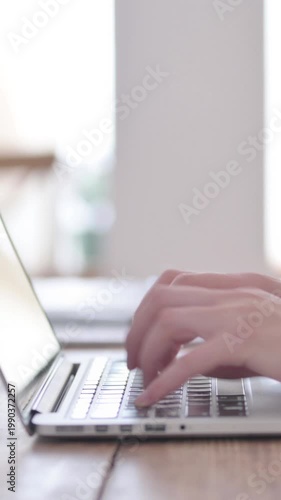 Close Up of Female Hands Typing on Laptop, Side View, Vertical Video