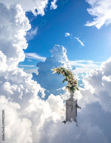 A surreal image of a floral arrangement atop a classical pedestal piercing through a sea of billowing white clouds. Sunlight streams through blue sky