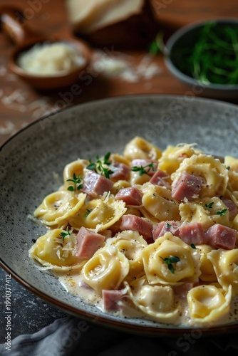 Creamy tortellini alla panna with diced ham and grated parmesan cheese