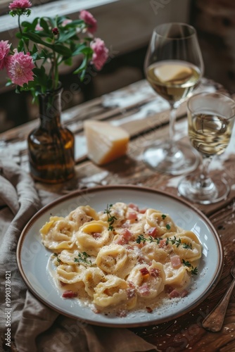 Creamy tortellini alla panna with diced ham and grated parmesan cheese