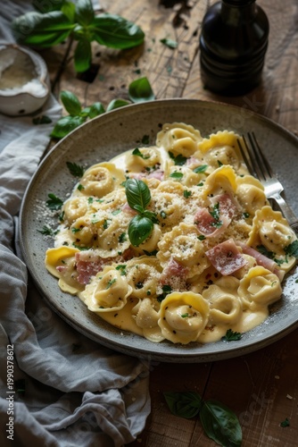 Creamy tortellini alla panna with diced ham and grated parmesan cheese