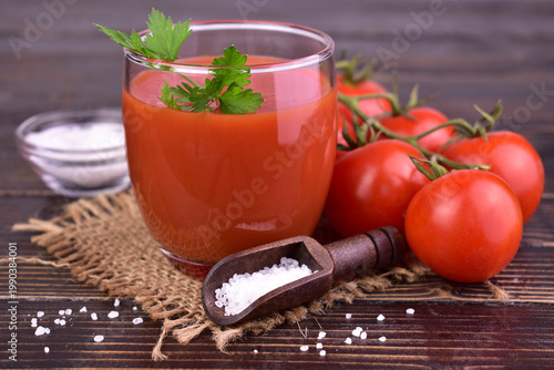 A glass of organic tomato juice with salt. Close-up.
