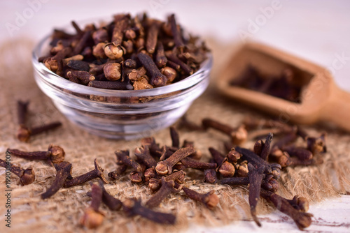 Clove spice in a glass plate. Aromatic seasoning.
