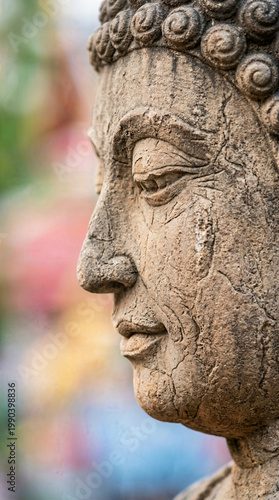 Serene stone buddha statue face portrait for zen meditation and spiritual mindfulness concept