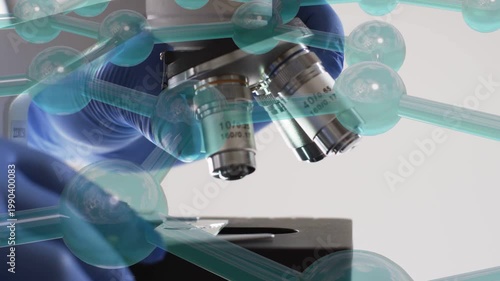 Blue gloved hands entering frame starting turret spin aligning slide centering lens over sample