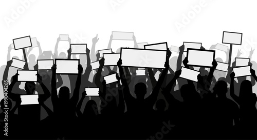 People holding protest signs in crowd.