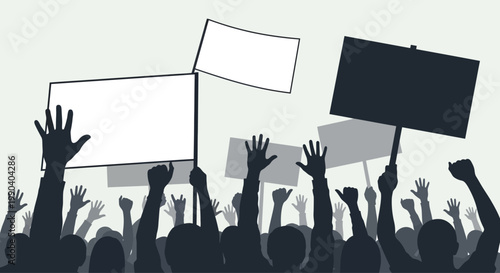 People holding protest signs in crowd.