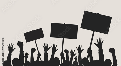 Protesters with raised hands holding signs.
