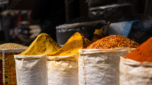 spices on display in bags at traditional market