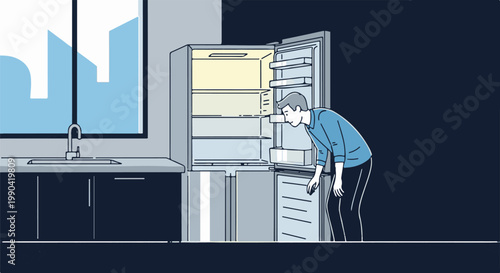 Man looking into an empty refrigerator in a kitchen