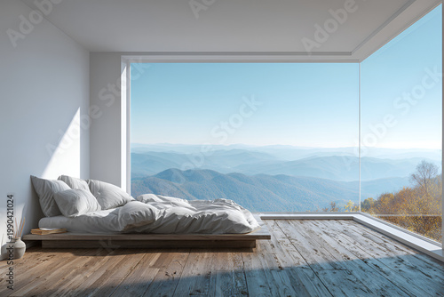 Modern bedroom showcasing a low platform bed with white linens. Large window frames scenic mountain vistas, filling the room with natural light