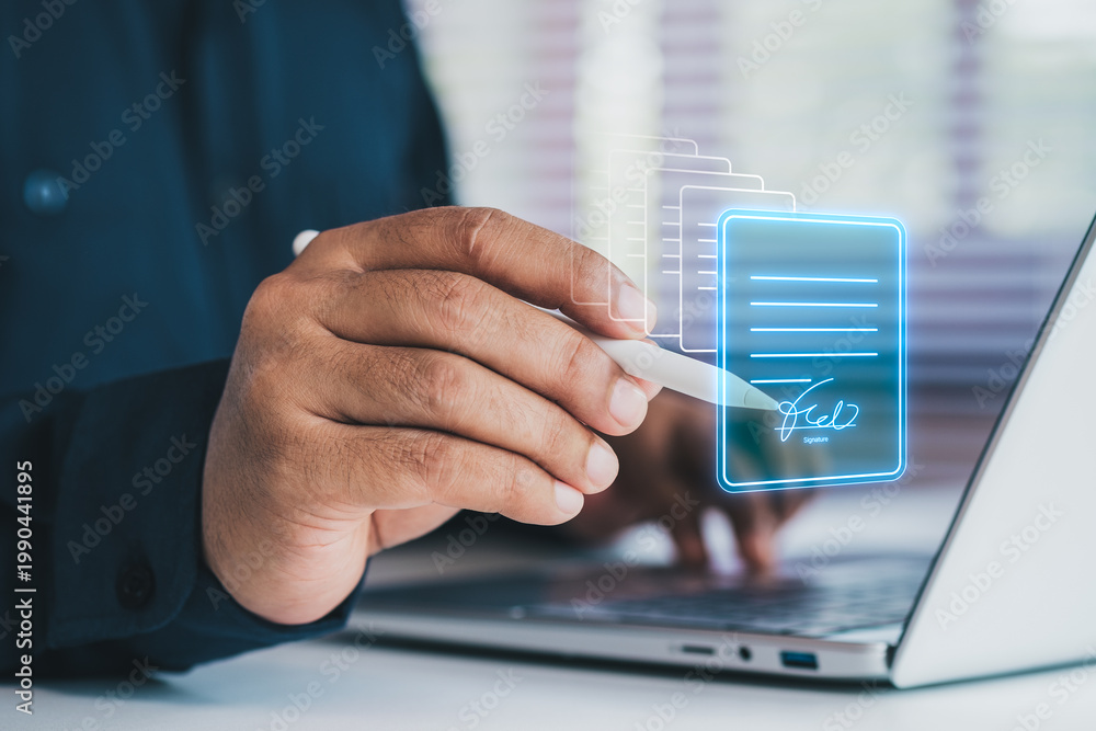 Fototapeta premium Business professional using digital pen signing electronic document on laptop, virtual interface, e-signature technology concept, secure online contracts, paperless workflow, digital transformation
