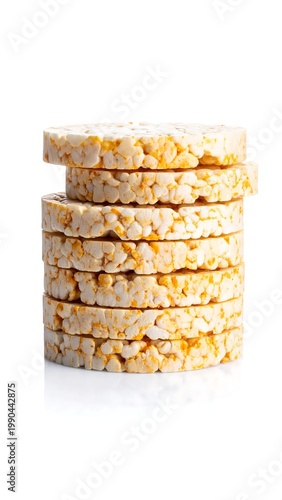 Vertical Stack Of Seven Crispy Puffed Corn Cakes With Orange Seasoning Isolated On Reflective White Background