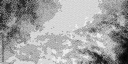 Abstract black and white halftone gradient background with dense dotted texture and grunge fade effect, modern vector design for bold print, digital, and creative projects