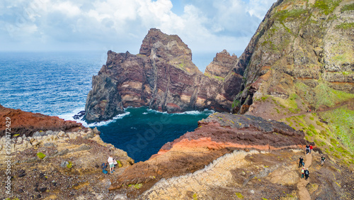 Quadro su tela Hikers explore the stunning volcanic cliffs and turquoise waters of Ponta de Sao Lourenço, Madeira