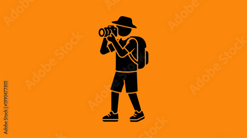 Silhouette of a photographer capturing a moment in nature with a camera.