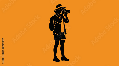 Silhouette of a photographer capturing a moment in nature with camera.