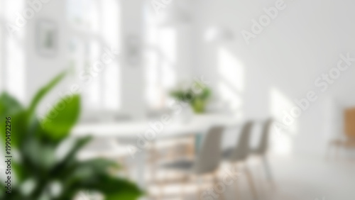 Modern Bright Interior with Green Plant and Blurred Background.