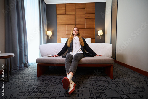 Konstfotografi Young woman relaxing in hotel room during daytime