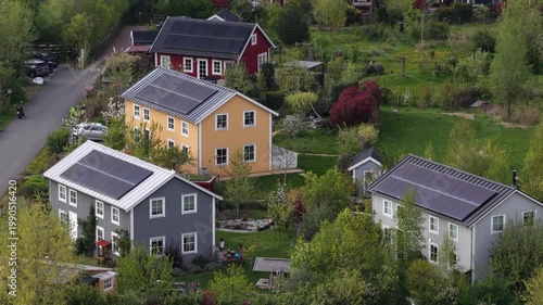Sustainable eco village with solar panels on rooftops