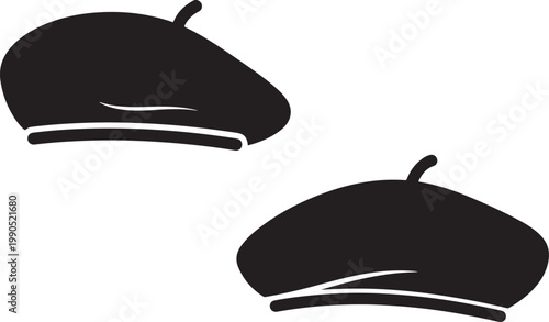 Two black berets displayed against a plain white background