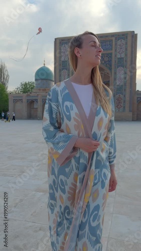 Woman in Uzbek robe at Hazrati Imam Complex square in Tashkent