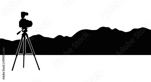Silhouette of a professional camera on a tripod.