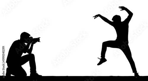 Silhouette of a photographer capturing a dancer in motion.