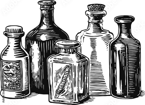 Five vintage glass bottles with corks and labels, old apothecary or medicine containers