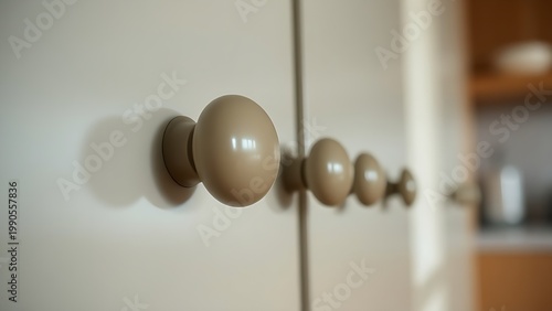 bakelite. Close-up of Art Deco style bakelite knobs on kitchen cabinet, vintage aesthetic. product launch decks, UI/UX mockups, designed for product launches and innovation pitches, clarifies data.