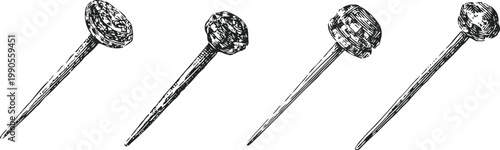 vintage drawing of four antique nails with rounded heads angled in different directions