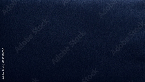 Dark navy blue textured background with subtle grain and soft lighting