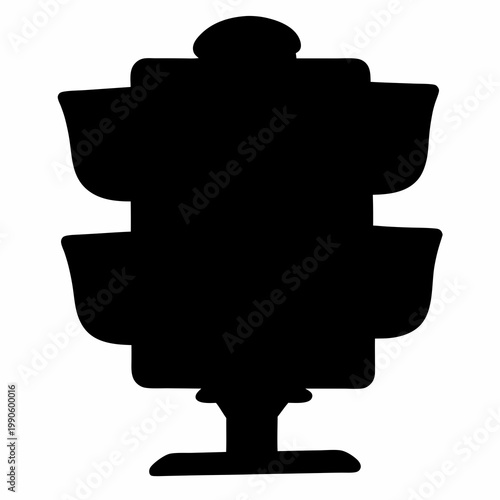 Silhouette of a striking three tiered fountain with interesting pedestal design