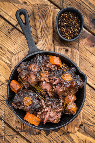 Bild auf Leinwand Tender braised oxtail pieces in savory gravy with carrots, gourmet beef stew on