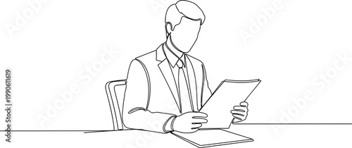 Businessman working on digital tablet.