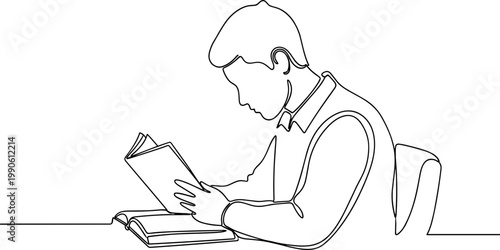 Man reading book on floor.