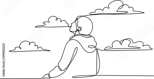 Man sitting and looking away calmly.