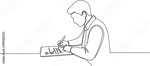 Man sitting and writing on paper.