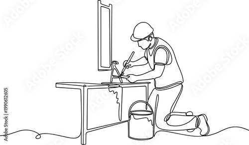 Man wearing a hard hat working.