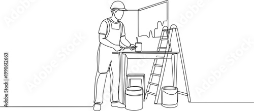 Man wearing overalls and hard hat.