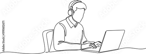 Man wearing headset working on laptop.