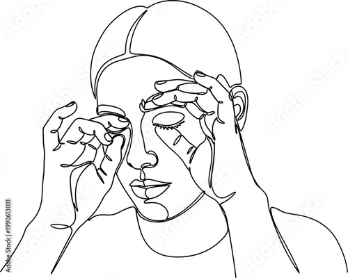 Woman applying eye cream on face.