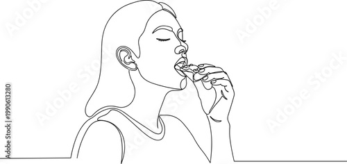 Woman eating chocolate bar sweet treat.